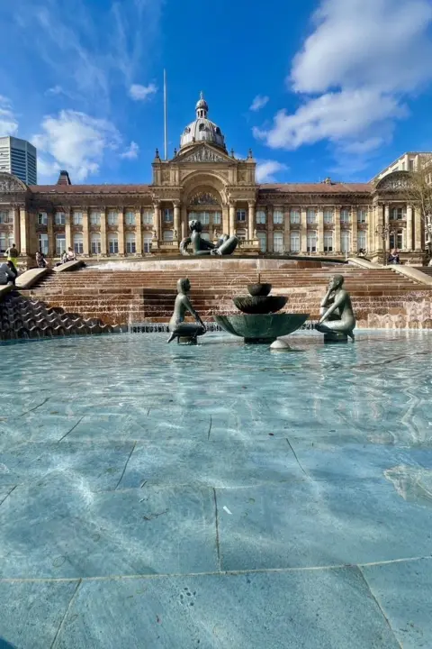 @BiteYourBrum Victoria Square in Birmingham showing fountains in the foreground and the council house in the background.