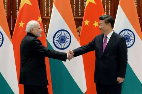 Getty Images Indian Prime Minister Narendra Modi (L) shakes hands with Chinese President Xi Jinping (R) in 2-16 in China at the West Lake State Guest House on September 4, 2016 in Hangzhou, China. The 11th G20 Leaders Summit will be held from September 4-5. (Photo by Wang Zhou - Pool/Getty Images)
