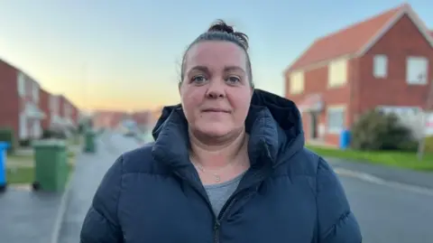 Laura Kelly stood in Tuxford looking at the camera.