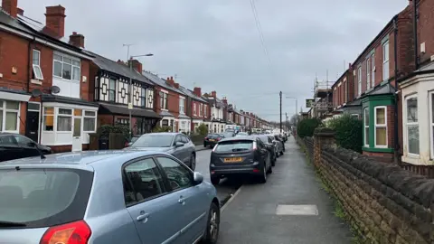 Cars on residential street.