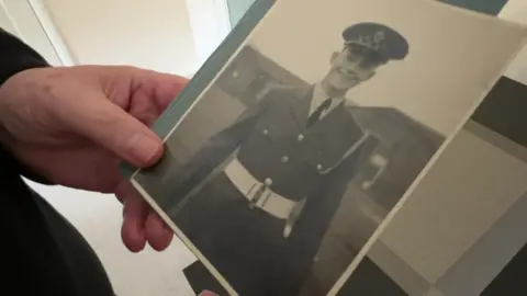 Joe Campbell/BBC A photo of a young man in an RAF uniform.