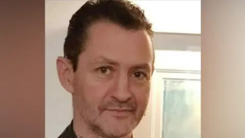 Devon and Cornwall Police Handout photo from police of Daniel Coleman. He has stubble and dark gelled hair.