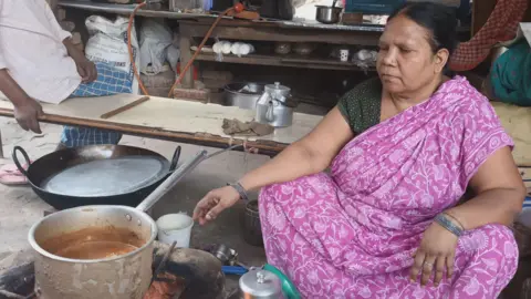 A woman making tea