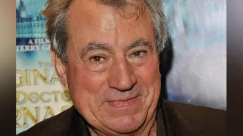 An old image of Terry Jones at an event. 