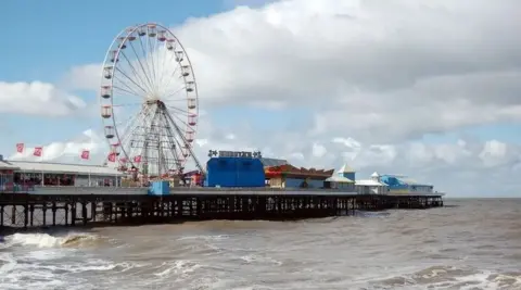 Central Pier in Blackpool, a pier with a theme park on and a big wheel. 