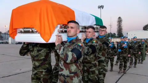 Irish Defence Forces Soldiers carrying private Rooney's coffin