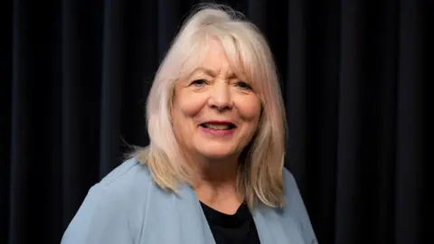 BBC A close up shot of actress Alison Steadman looking to camera with a black background