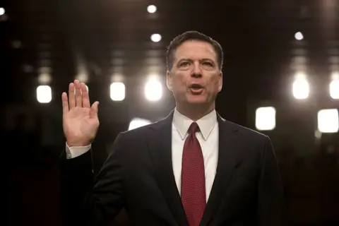 Getty Images Former FBI Director James Comey is sworn in while testifying before the Senate Intelligence Committee on 8 June 2017 