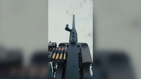 View from behind the barrel of a machine gun.