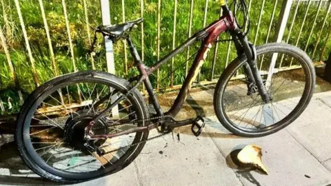 London Fire Brigade The bike, with fire damage visible to the rear
