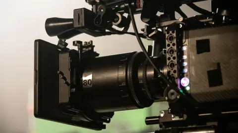 A professional digital cinema camera, on a film set.