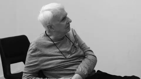 Nobby Clark A black and white image of a man with white hair