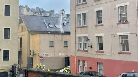 Firefighters extinguishing a fire in Edinburgh.