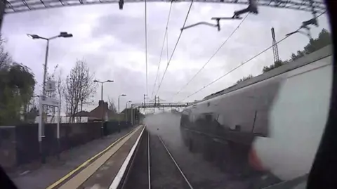 A camera on one of the trains captures a cloud of dust on the tracks at Kings Langley station