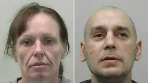Northumbria Police Mugshots of Tait and Harle. She has lank brown hair and a cut on her chin. He has a vacant expression, shaved head and slight stubble.