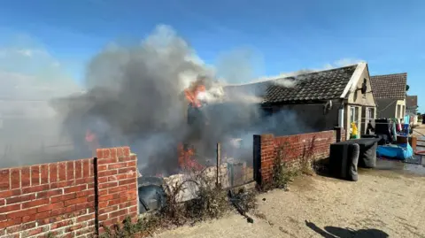 Essex County Fire and Rescue Service A lot of smoke coming out of a building 