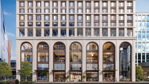 5plus Architects Seven tall arches can be seen at the front of the first four floors of the building, with smaller windows on multiple floors above.