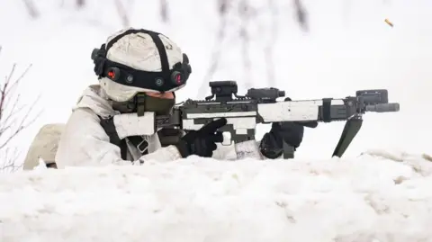 Getty Images A Swedish soldier taking part in a training exercise on the Norwegian-Finnish border in the Arctic