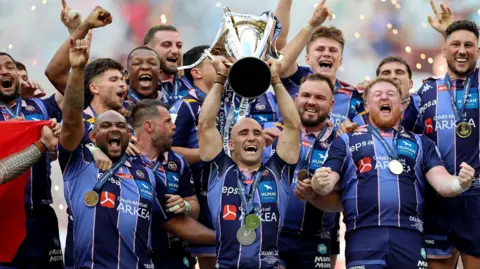 Maxime Lucu lifts the Investec Champions Cup trophy