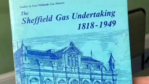 The front page of a light blue leaflet, with what looks like a dark blue highly detailed hand drawn image of Canada House, and the words; Studies in East Midlands Gas History: The Sheffield Gas Undertaking 1818-1949.