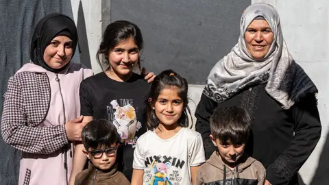 Fatima on the right, pictured with her family