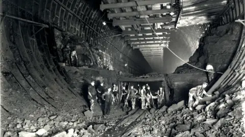 Merseytravel Workers pictured in the depths of the tunnel during building work