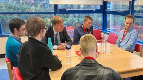 A group of students at Sense College, Loughborough, talk to Disabilities Minister Sir Stephen Timms