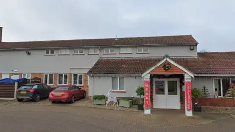 External image of Aria Court, a two-storey building with light blue rendering.