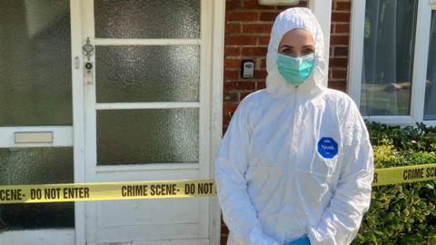 Dr Hannah Moore in a forensic suit