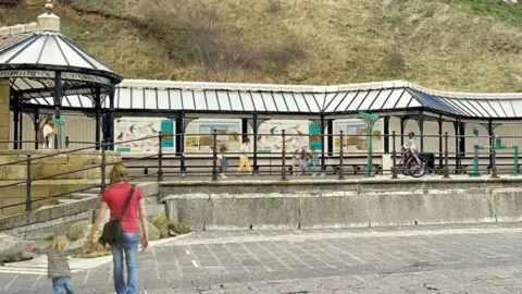 North Yorkshire Council An artist's impression of how the viewing station would look, with a covered seating area above a promenade