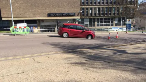 Car stuck in hole