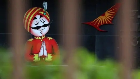 Getty Images The mascot of India's flagship carrier Air India- 'Maharaja' is displayed outside the Airlines building in New Delhi, India on October 10, 2021,