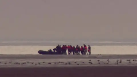 Migrants setting off from France in a boat