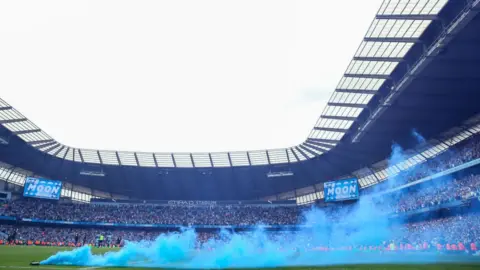 Getty Images A flare at Manchester City
