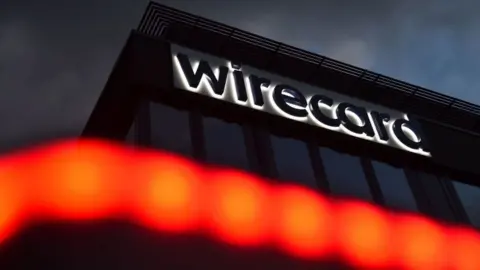 CHRISTOF STACHE/AFP The logo of German payments provider Wirecard is seen at a building of the company's headquarters in Aschheim near Munich, southern Germany, on September 2, 2020