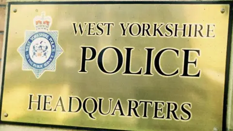 Brass nameplate showing West Yorkshire Police