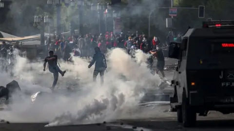 AFP Demonstrators clash with soldiers in Santiago