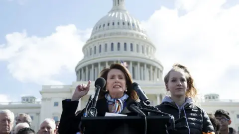 EPA US House Minority Leader Democrat Nancy Pelosi (C) delivers remarks at rally to participate in the national school walkout over gun violence on the West Front of the US Capitol in Washington, DC, USA, 14 March 2018