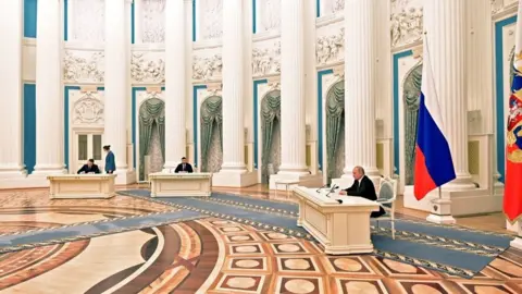 AFP via Getty Images Putin in the Kremlin on Monday