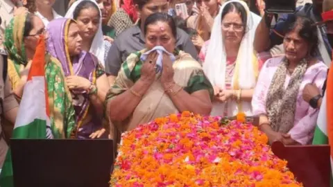 BBC/ASIF ALI Harbola's family led the tributes