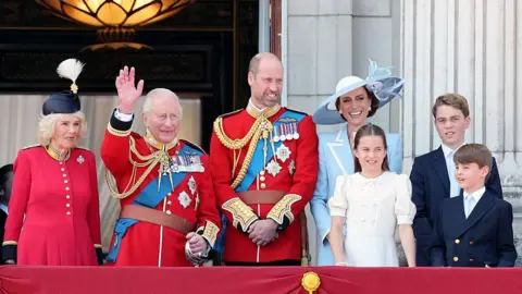 Getty Images Queen Camilla, King Charles III, Prince William, Prince of Wales, Princess Charlotte of Wales, Catherine, Princess of Wales, Prince George of Wales and Prince Louis of Wales pictured on the balcony of Buckingham Palace.