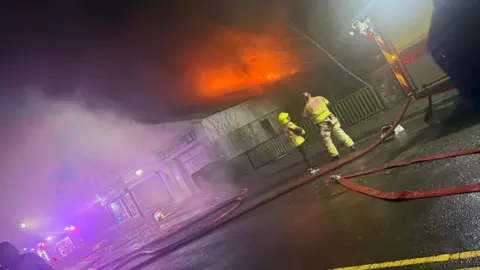 James Wilkins Firefighters responding to blaze. 