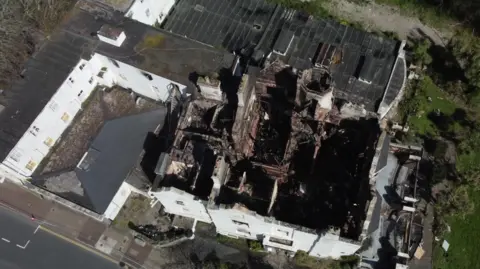An ariel view of the former Sherwood Hotel. The roof is burnt.