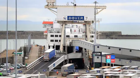 Gareth Fuller/ PA Lorries board at the Port of Dover