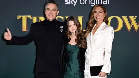 Getty Images Robbie with his with Ayda and eldest daughter, Teddy 