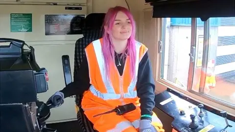 Bessie in cab of freight train