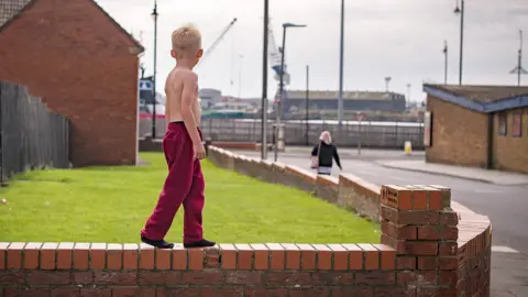 Getty Images Child on a wall