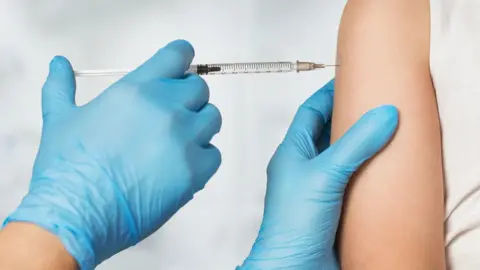 Getty Images A child being given a vaccine