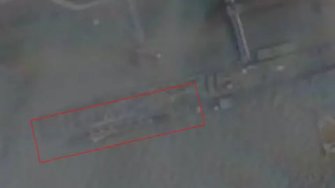 Planet Labs A satellite image appears to show a submarine at a pier near Wuhan, China.