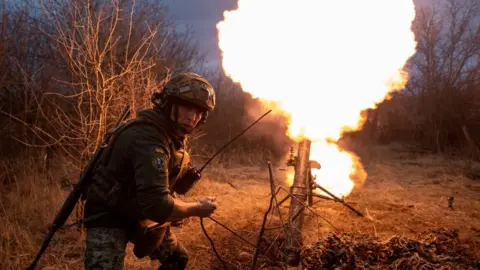 Getty Images Ukrainian soldier fires a mortar